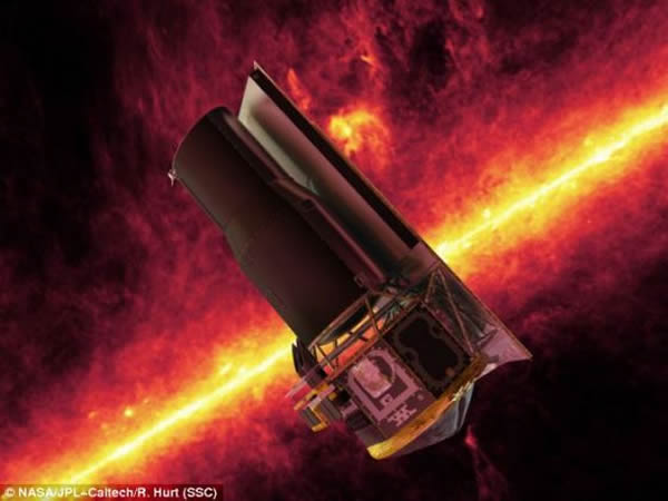 这是斯皮策太空望远镜在红外线天空衬托下的情景。如今,它可能有助于科学家寻找围绕夭折恒星周围运行的可能适于居住的行星。