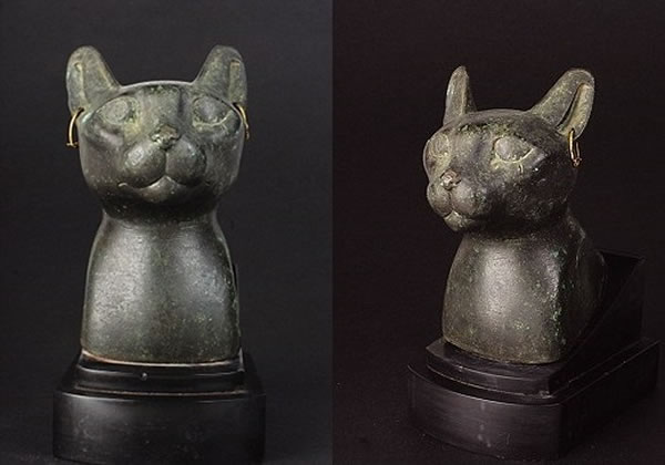 该陈旧猫头青铜雕像,估计是公元前600年的古埃及文物。