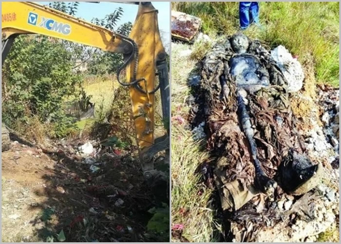 挖掘机进行挖掘时,意外起出一副白色棺木,内藏一具干尸。