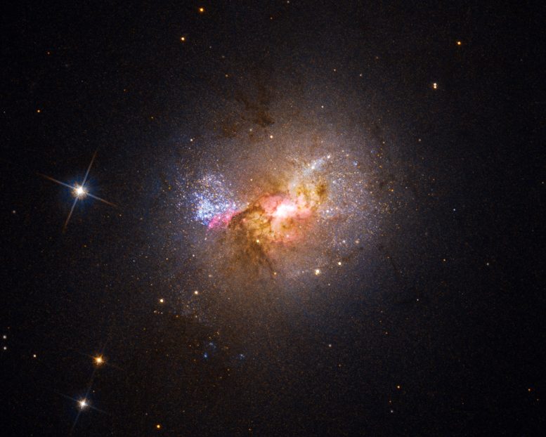 矮星系Henize 2-10光谱分析显示气体外流从黑洞延伸到明亮的恒星诞生区